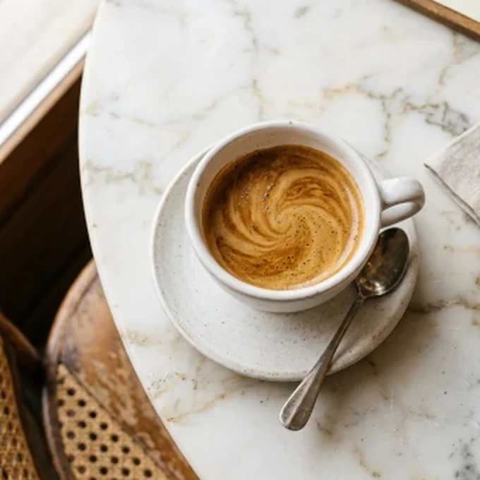 Espresso served on a marble cafe table